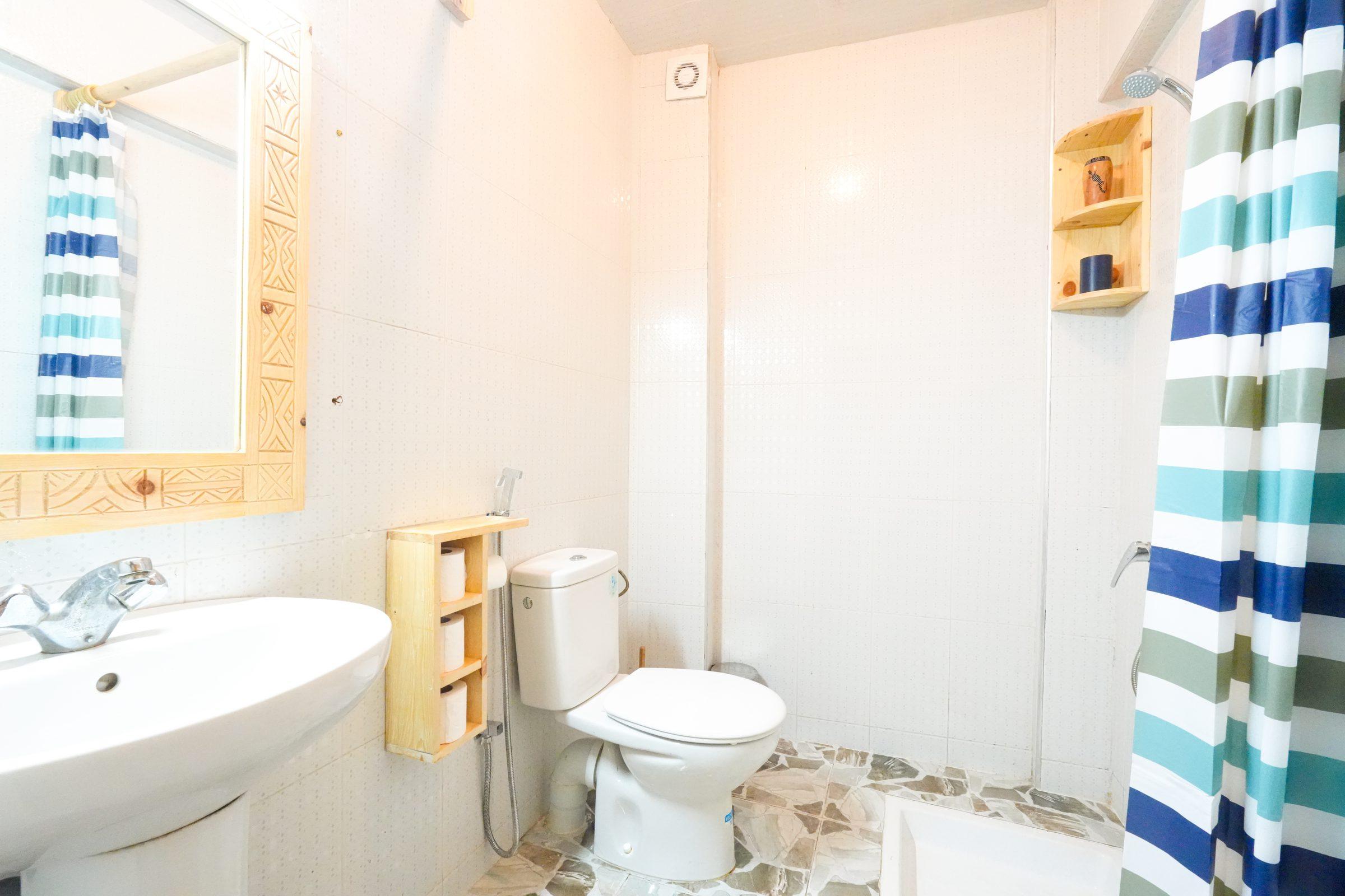 Clean bathroom with sink and towel rack